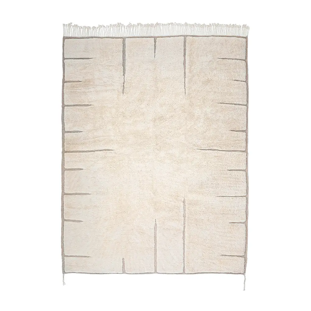 Hand-knotted rectangular beige rug with subtle linear patterns and light fringe on one end, displayed on a white background. This artisanal rug adds a touch of elegance to any space.