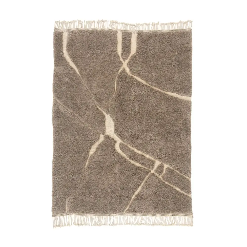 A rectangular gray hand-knotted rug with beige abstract lines and fringe on the shorter edges, displayed on a white background.
