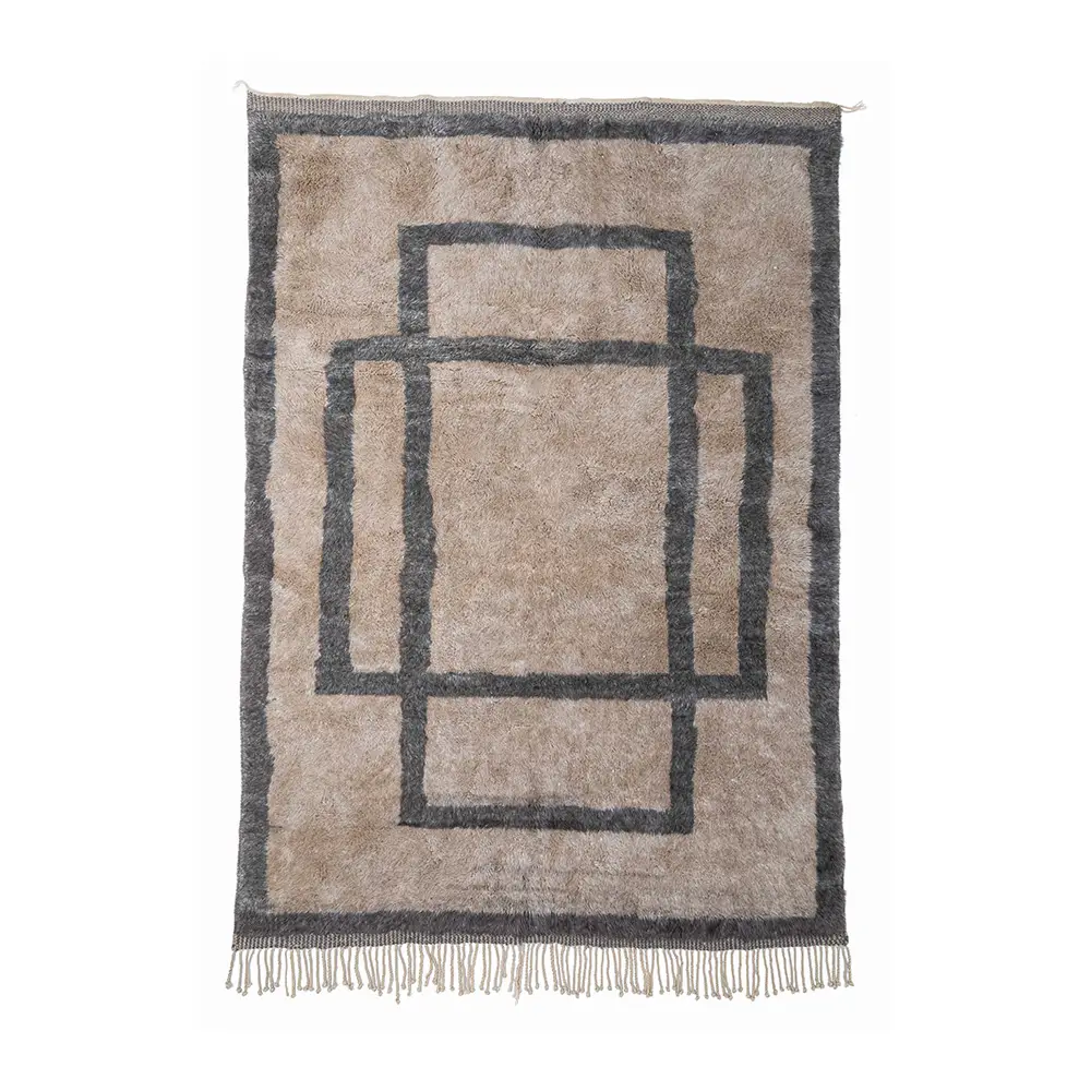 Rectangular taupe rug with a dark border and three overlapping dark rectangles in the center; short fringe along the shorter edges.