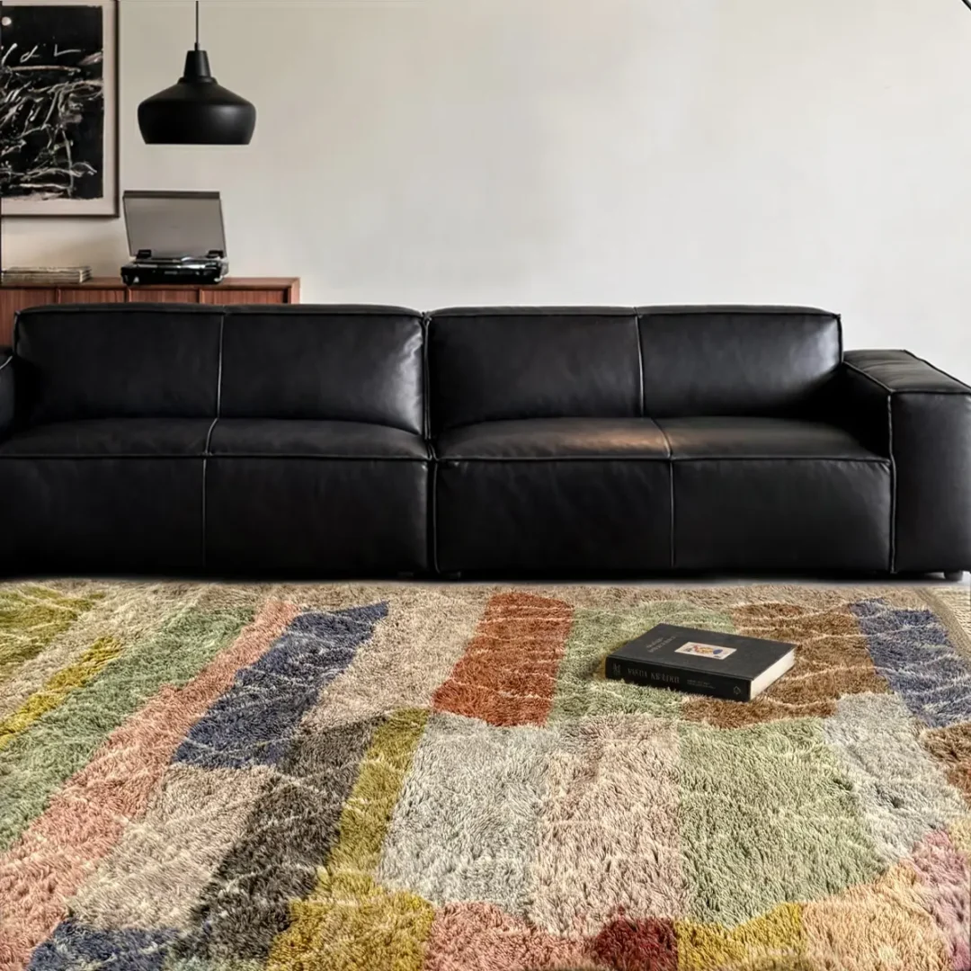 Azele Studio large colorful wool rug styled in modern living room with honeycomb pattern and earthy tones