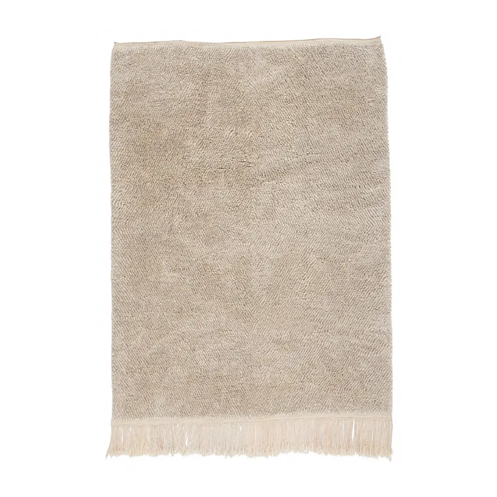 This luxury hand-knotted rug features a beige dotted pattern and elegant fringed edges, adding a touch of sophistication to any space.