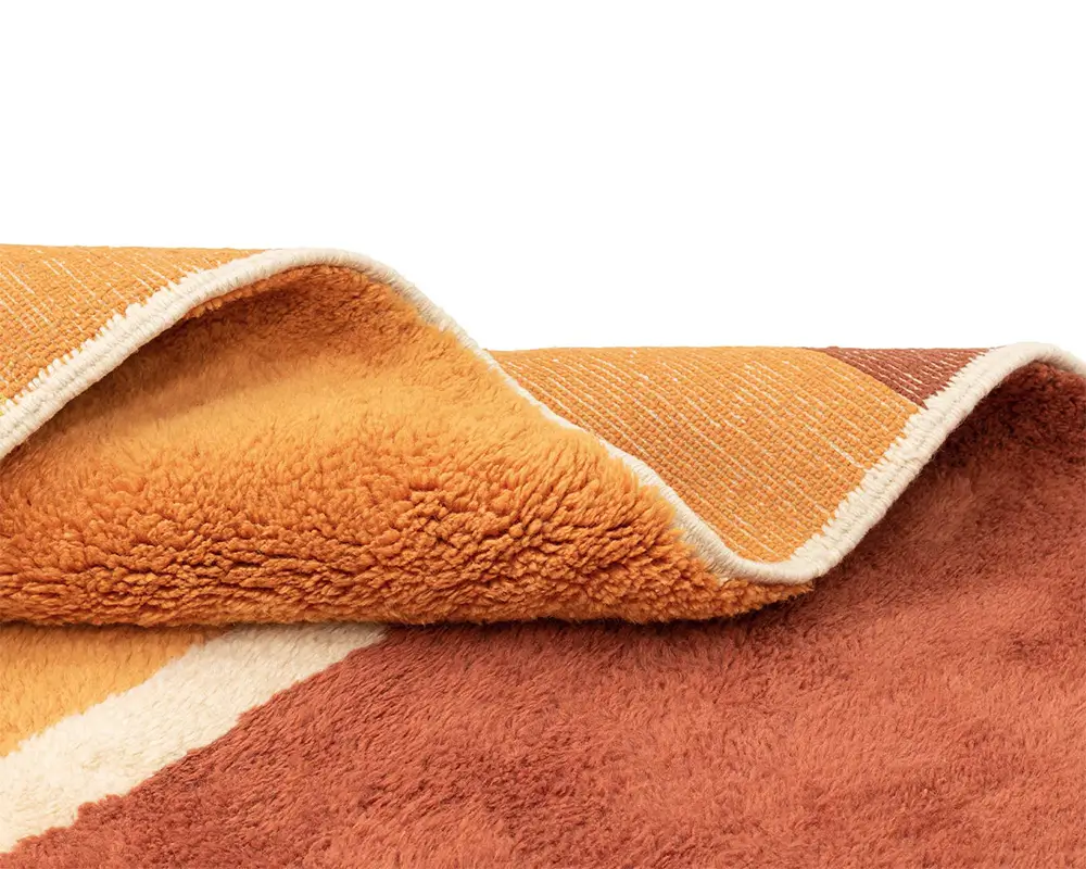 Azele Studio large abstract rug close-up of textured amber yellow surface and hand-knotted weave