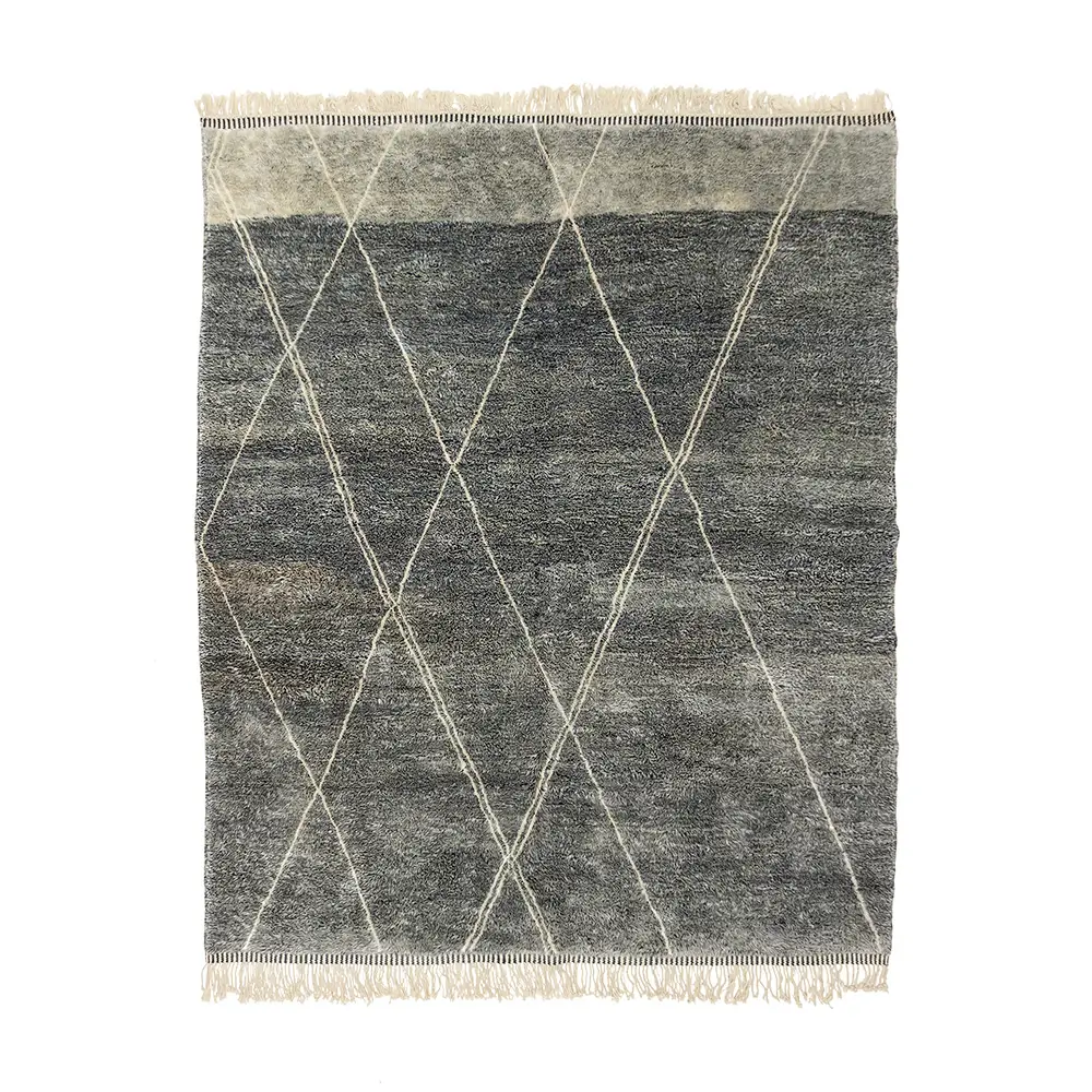 This dark gray, hand-knotted rug exudes elegance with its textured surface and a sophisticated pattern of intersecting white diagonal lines. Fringed on the shorter edges, its a perfect piece for those seeking luxury rugs that add an element of handmade home decor to any space.