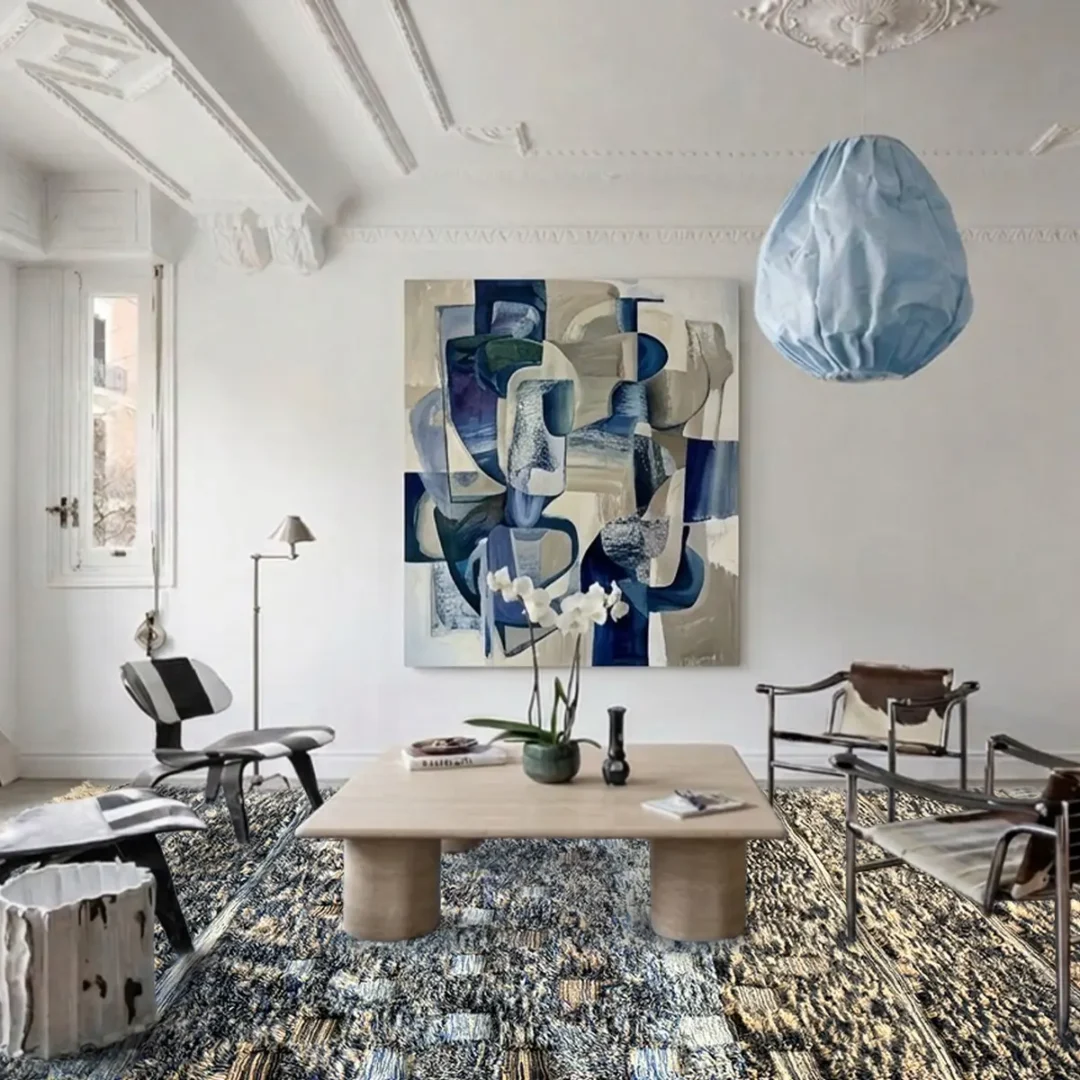 Azele Studio blue and tan abstract rug styled in modern dining room with natural landscape pattern